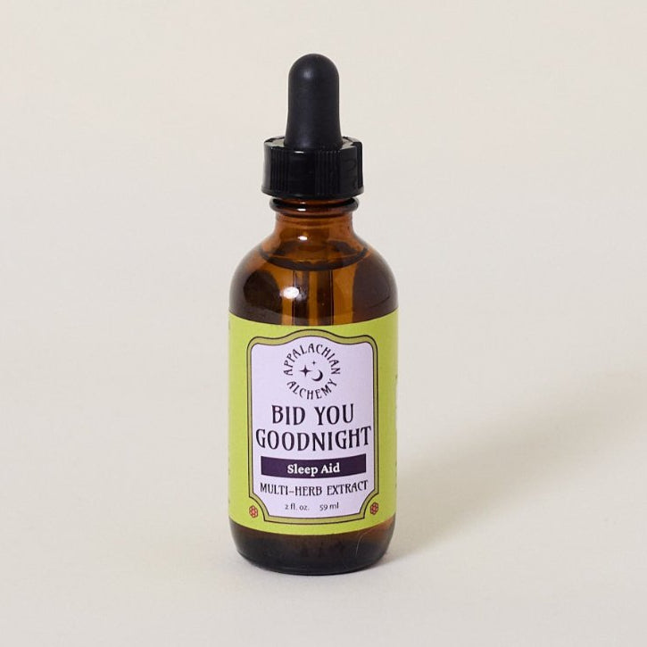 A bottle of Bid You Goodnight Multi-Herb Sleep Extract with a dropper lid, against a white background.